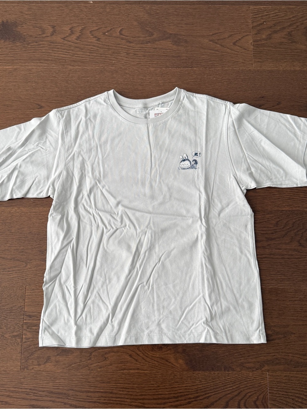 Uniqlo Light Gray Short Sleeve Tee with Small Character Graphic